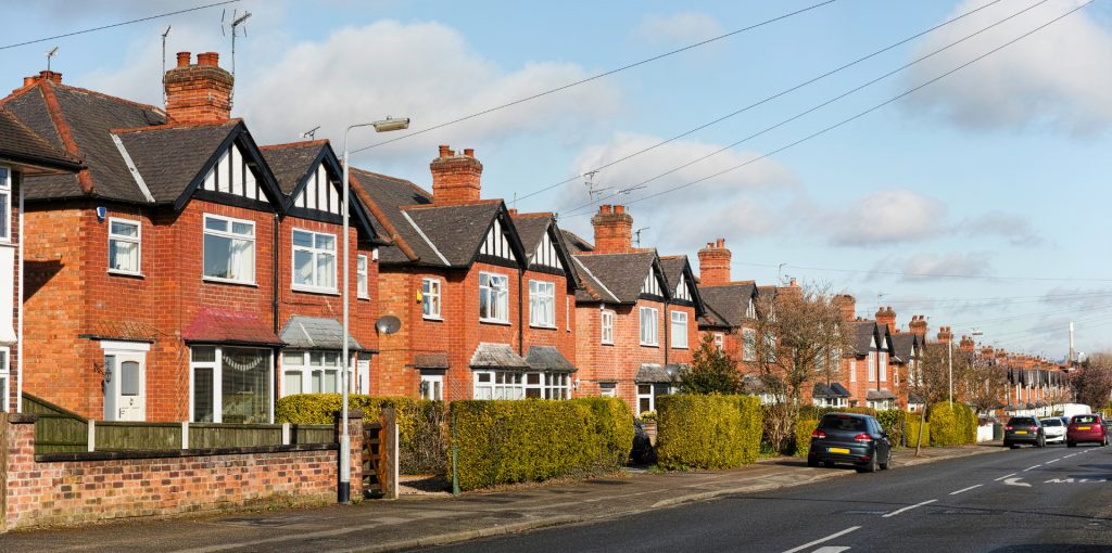 Row of UK semi-detached houses representing local authority housing